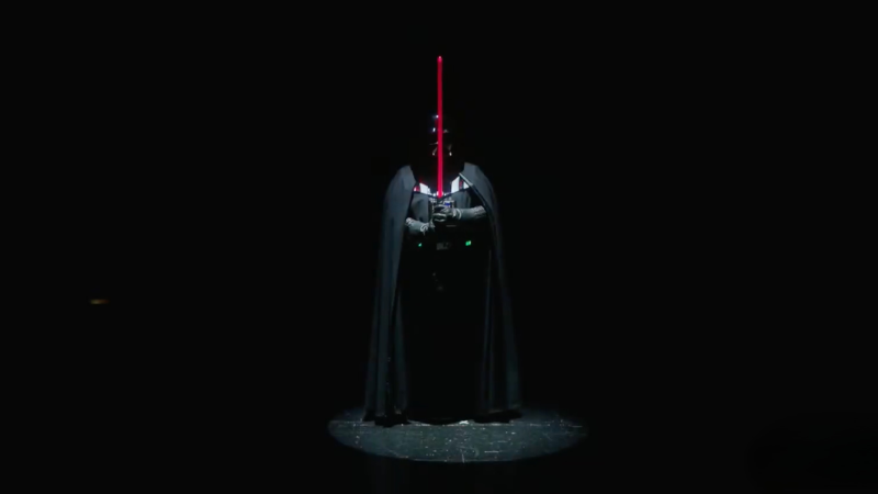 A screengrab from the official D&D Keynote at Gen Con 2026, featuring Star Wars' Darth Vader walking across the stage.
