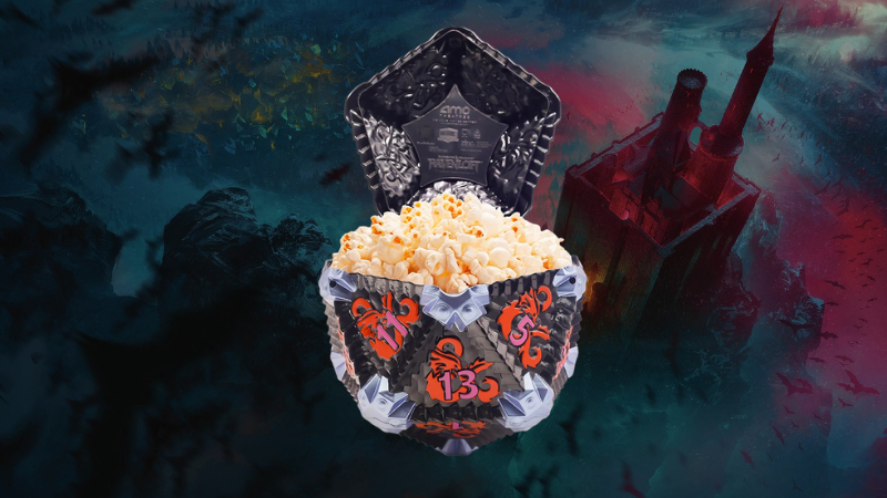 The official Ravenloft D&D Popcorn Bucket from AMC set against the backdrop of Castle Ravenloft.