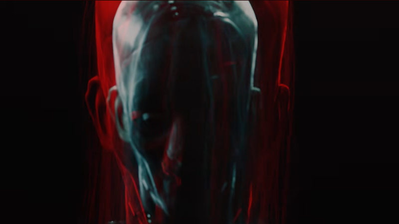 An image from the D&D Project Lamordia teaser video, featuring a creepy, out of focus face framed in darkness.